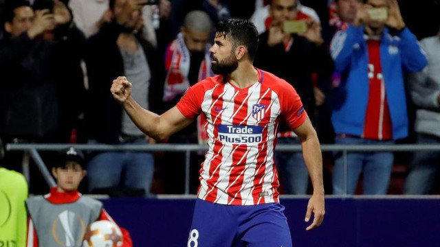 Diego Costa celebra su gol en el Atlético - Arsenal. JUANJO MARTÍN (EFE)