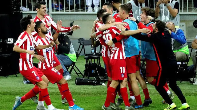 Os xogadores do Atlético celebran un gol. EFE