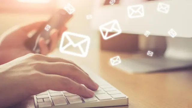 Email marketing and newsletter concept, Hand of man sending message and mobile phone with email icon