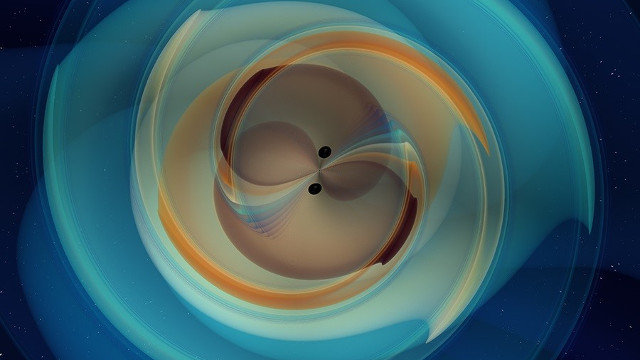 Simulación de una fusión de dos agujeros negros. EFE