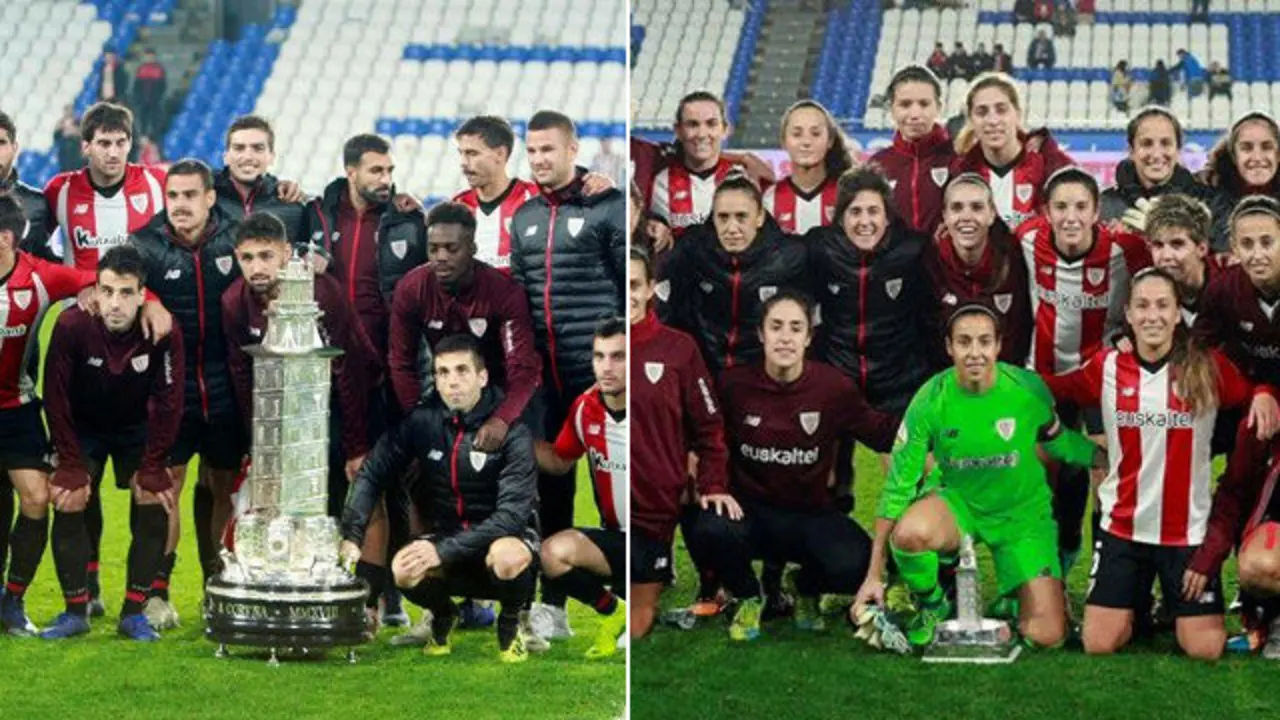 Los jugadores y las jugadores del Athletic con sus respectivos trofeos. EFE