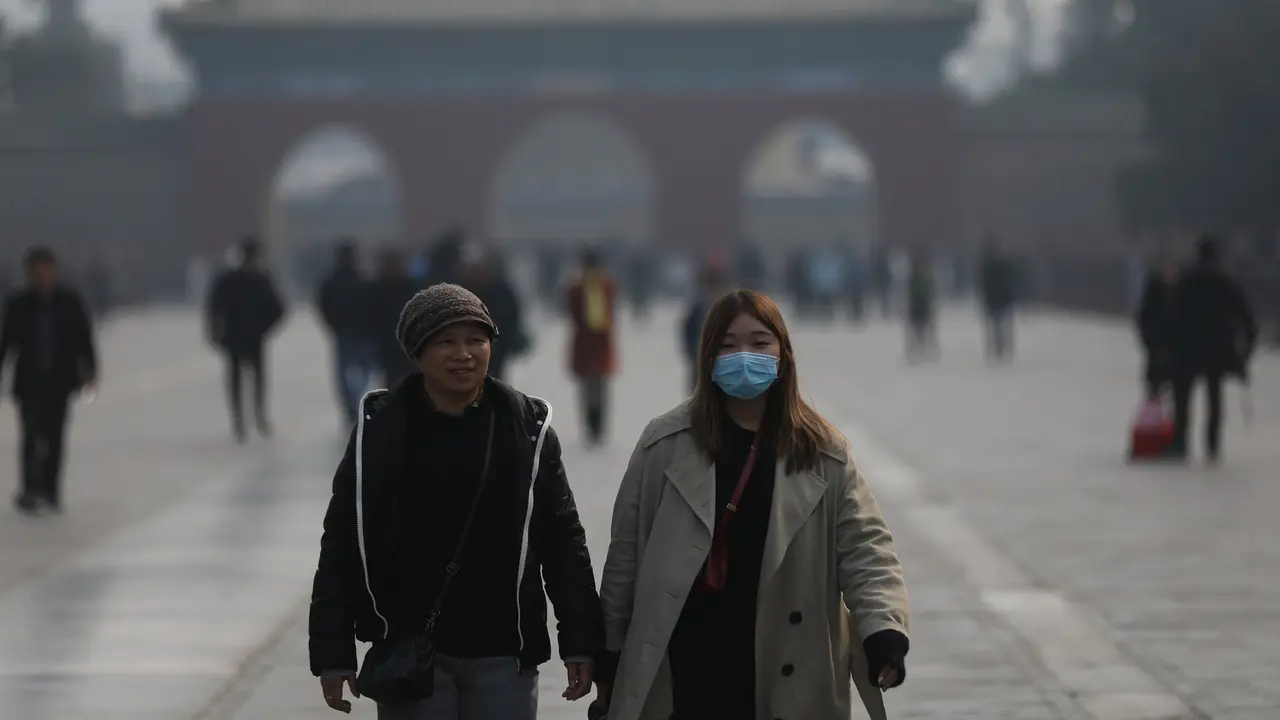 Ciudadanos chinos con mascarilla. EP