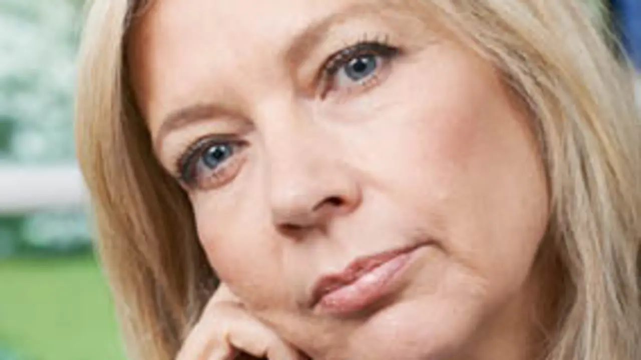 Head And Shoulders Portrait Of Thoughtful Mature Woman At Home