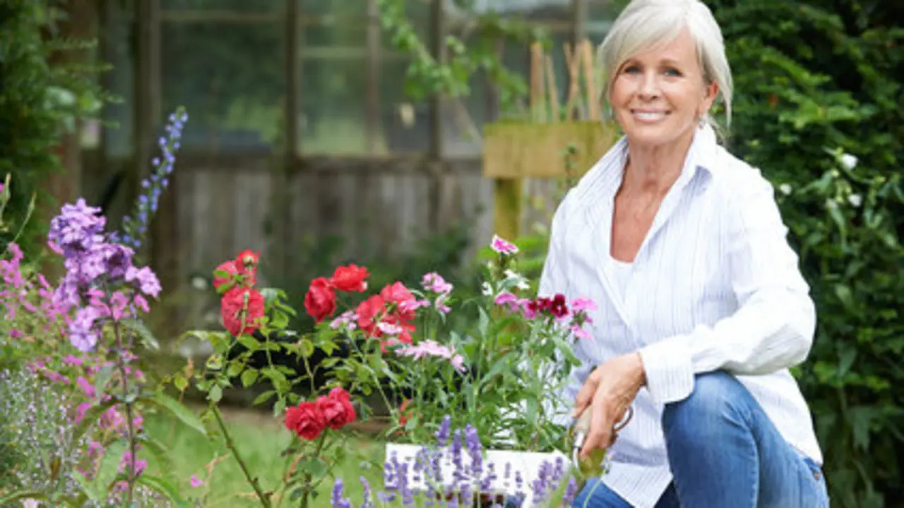 Portrait Of Mature Woman Gardening
